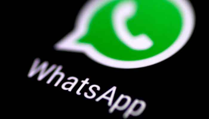 The WhatsApp messaging application is seen on a phone screen on August 3, 2017. — Reuters