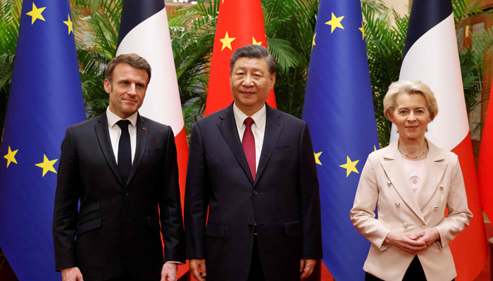 Chinas President Xi Jinping (C), his French counterpart Emmanuel Macron (L) and European Commission President Ursula von de Leyen meet for a working session in Beijing on April 6, 2023. — AFP