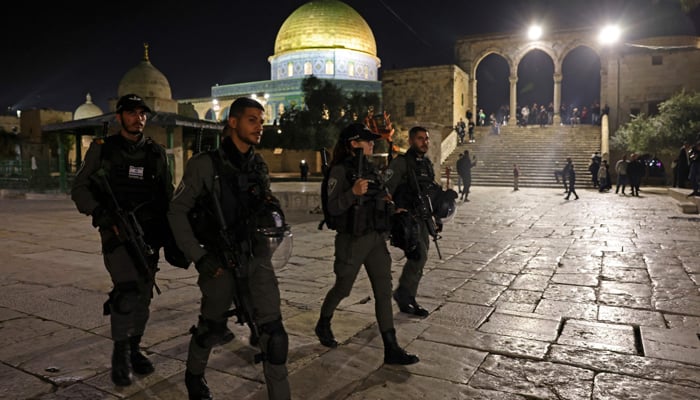 Israeli security forces patrol outside the Dome of the Rock shrine in Jerusalems al-Aqsa Mosque compound during the holy fasting month of Ramadan, on April 8, 2023. — AFP