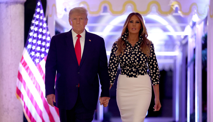 Former US President Donald Trump and former first lady Melania Trump arrive for an event at his Mar-a-Lago home on November 15, 2022, in Palm Beach, Florida. — AFP