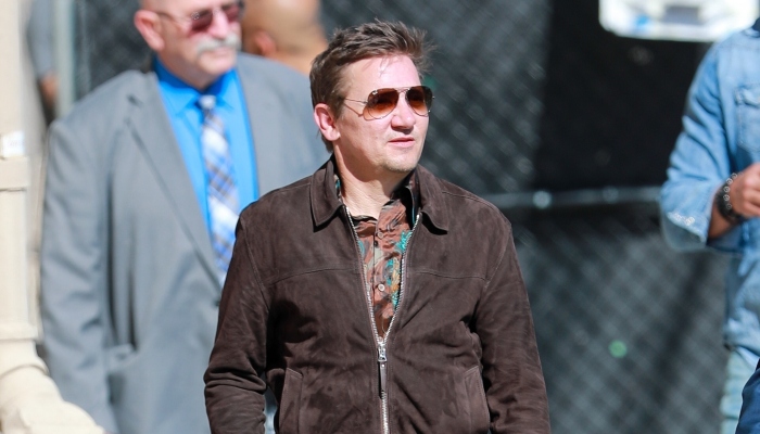 Jeremy Renner uses walking stick as he walks into Jimmy Kimmel Live studio