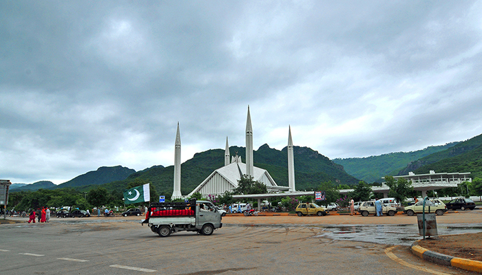 Thick clouds hover over the Faisal Mosque in Islamabad. — APP/File