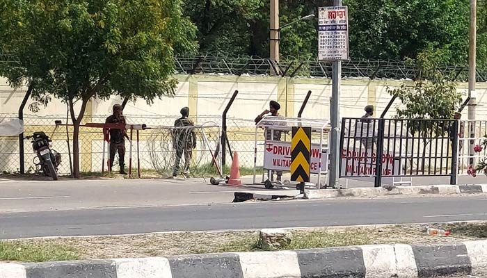 Indian army soldiers stand outside a barricade outside a military base following a firing incident in Bathinda, India, April 12, 2023. — Reuters