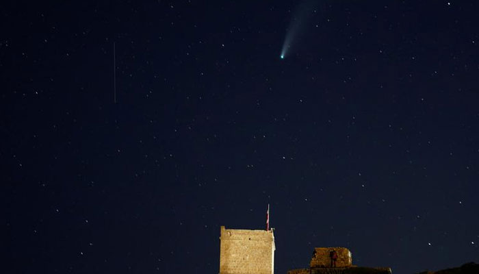 The Comet C/2020 or Neowise and a meteor are seen behind Ghajn Tuffieha Tower, a 17th-century coastal fortification, at Ghajn Tuffieha Bay, Malta. — Reuters/File