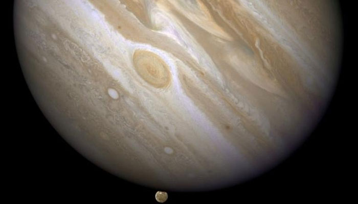 The planet Jupiter is shown with one of its moons, Ganymede (bottom). — Reuters/File