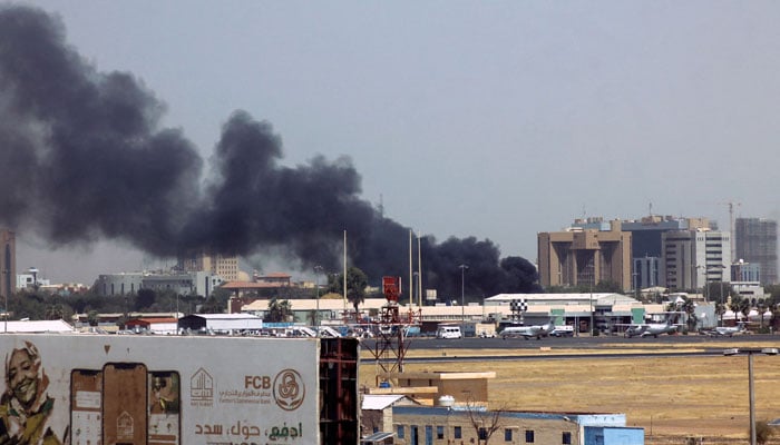 Heavy smoke bellows above buildings in the vicinity of Khartoums airport on April 15, 2023, amid clashes in the Sudanese capital. — AFP