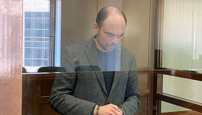 Russian opposition figure Vladimir Kara-Murza, accused of treason and of discrediting the Russian army, stands behind a glass wall of an enclosure for defendants during a court hearing in Moscow, Russia, April 17, 2023.—Reuters