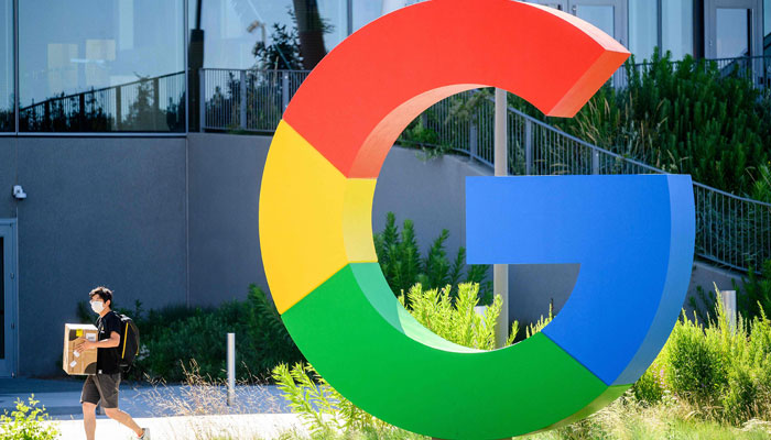 This photo shows a worker walking along a path at Googles Bay View campus in Mountain View, California. — AFP/File