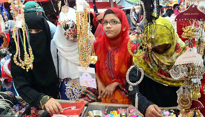 Customers view jewellery at a stall in Hyderabad ahead of Eid in this undated file photo. — APP