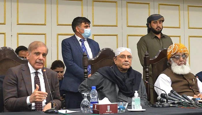 PDM leaders Maulana Fazal-ur-Rehman (right) talking with media persons along with Asif Ali Zardari (centre) and Shahbaz Sharif (left) in Islamabad on March 8, 2022. — AFP/File