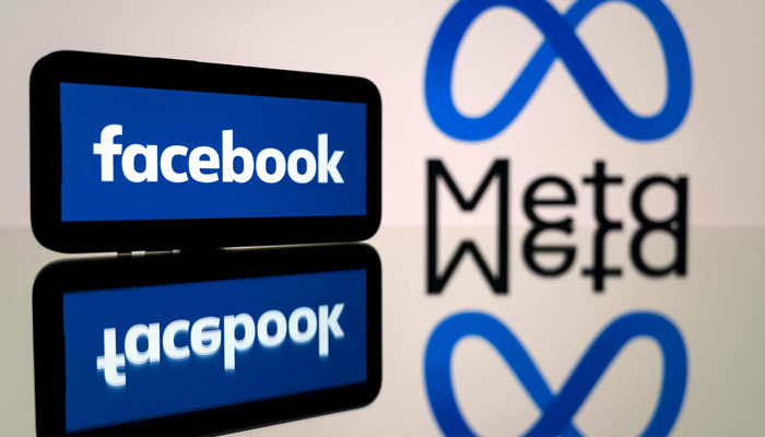 This photo shows a smartphone and a computer screen displaying the logos of the Facebook social network and its parent company Meta. — AFP/File