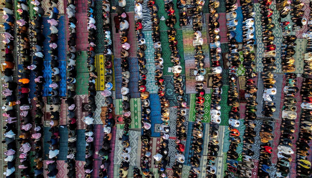 In this aerial view, worshippers pray on the first day of Eid ul Fitr in Syrias rebel-held town of al-Dana, in the northwestern Idlib province, on April 21, 2023.