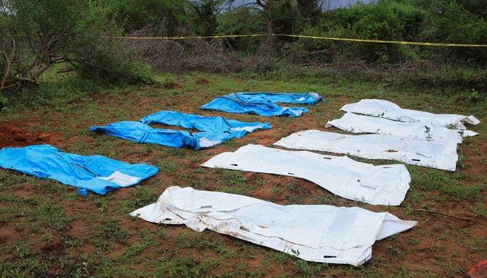 Body bags are seen arranged as forensic experts and homicide detectives exhume bodies of suspected members of a Christian cult named as Good News International Church, who believed they would go to heaven if they starved themselves to death, in Shakahola forest of Kilifi county, Kenya April 22, 2023. -Reuters