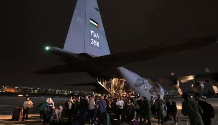 People evacuated from Sudan arrive at an airport. — APP/File