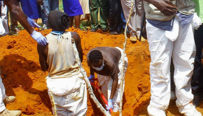Volunteers exhume bodies of suspected followers of a Christian cult named as Good News International Church, whose members believed they would go to heaven if they starved themselves to death, in Shakahola forest of Kilifi county, Kenya April 25, 2023. -Reuters