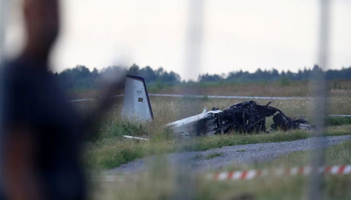 Small aircraft debris can be seen after it crashed in Sweden. — Reuters/File