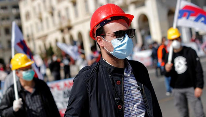 Members of a trade union PAME wearing protective masks take part in a rally commemorating May Day in Thessaloniki, Greece. — Reuters/File