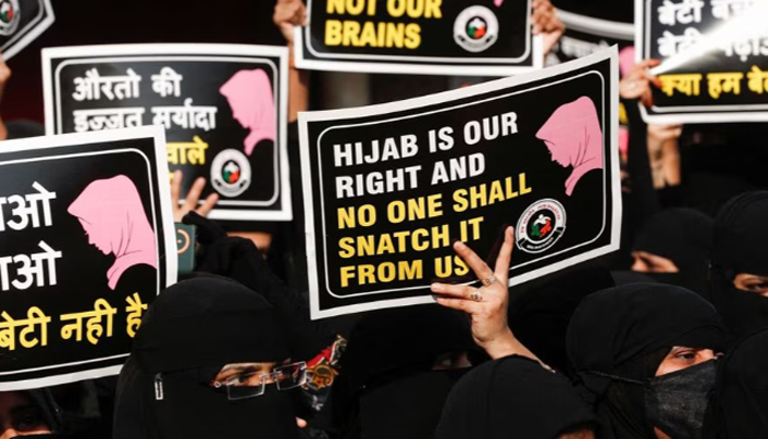 Women hold placards during a protest against a hijab ban in some colleges in Indias Karnataka state, on February 11, 2022. — Reuters/File