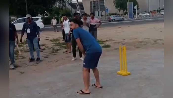 Afghanistan cricketer Rashid Khan plays street cricket in India during the IPL tour. — Twitter/@mufaddal_vohra