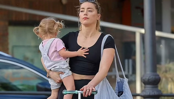 Amber Heard looks happy with daughter Oonagh Paige in Spain