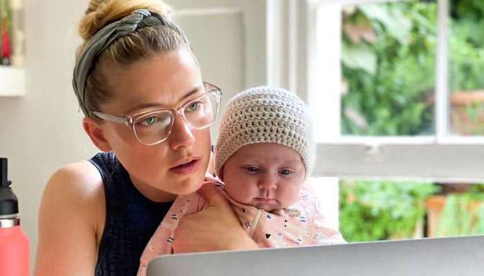 Amber Heard looks happy with daughter Oonagh Paige in Spain