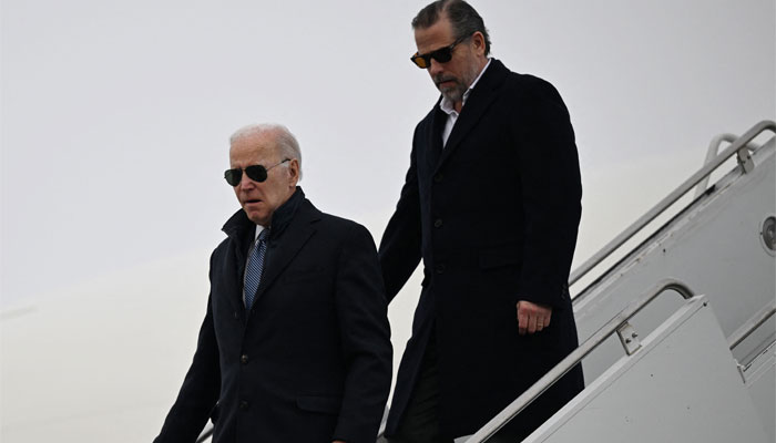 US President Joe Biden, with son Hunter Biden, arrives at Hancock Field Air National Guard Base in Syracuse, New York. — AFP/File