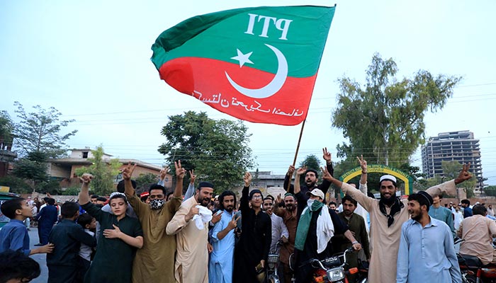 Supporters of Pakistans former prime minister Imran Khan shout slogans as they celebrate after Supreme Court ruled that the arrest of Khan was illegal, in Peshawar, on May 11, 2023. — Reuters