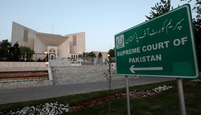 A sign points towards the Supreme Court building in this undated file photo. — Reuters