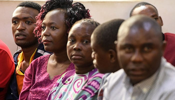 Relatives of victims of the so-called Shakahola forest massacre, follow court proceedings during the arraignment of pastor Paul Nthenge Mackenzie, at the Malindi law court, Kilifi county, on May 2, 2023. — AFP