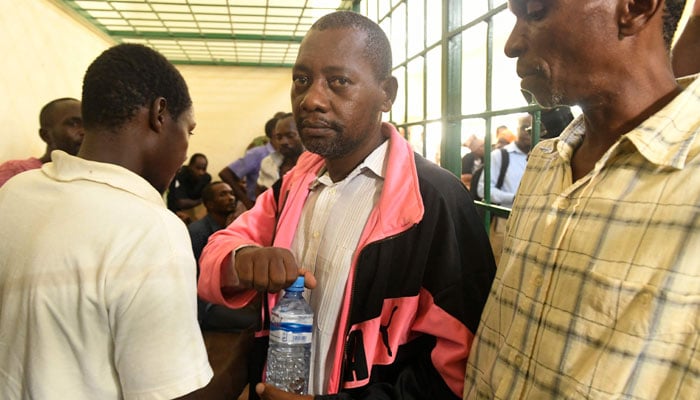 Self-proclaimed pastor Paul Nthenge Mackenzie, (C) appears at the Shanzu law courts in Mombasa on May 5, 2023. — AFP