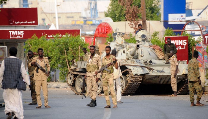 Sudanese army soldiers, loyal to army chief Abdel Fattah al-Burhan, man a position in the Red Sea city of Port Sudan, on April 20, 2023. — AFP