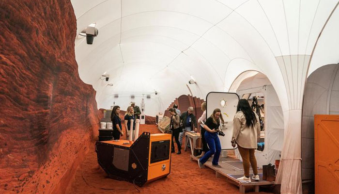 Members of the media tour inside the Mars landscape simulation area at Mars Dune Alpha, NASAs simulated Mars habitat, being used as preparations for sending humans to the Red Planet, at the agencys Johnson Space Center in Houston, Texas. — Reuters/File