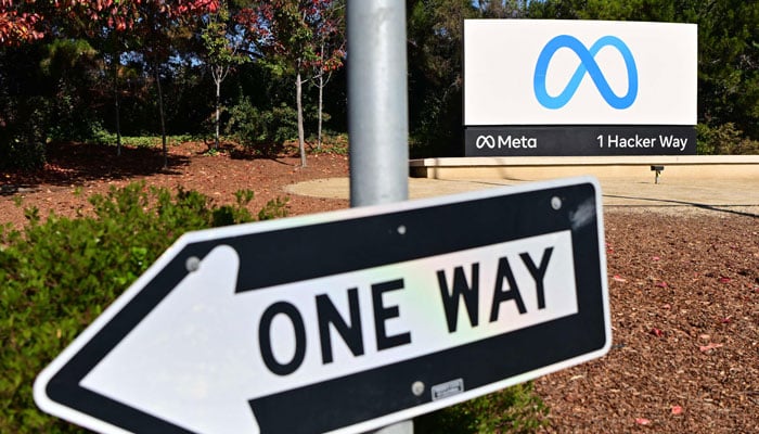 This photo shows Metas logo behind the arrow in Meta corporate headquarters in Menlo Park, California. — AFP/File