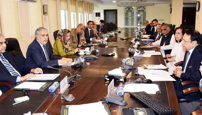 Finance Minister Senator Ishaq Dar chairing a meeting on budget proposals at the Finance Division. — PID