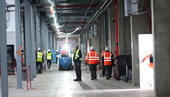 This photograph shows workers at the site of the newly constructed Billy-Berclau Gigafactory ACC battery factory, in Billy-Berclau, northern France. — AFP/File