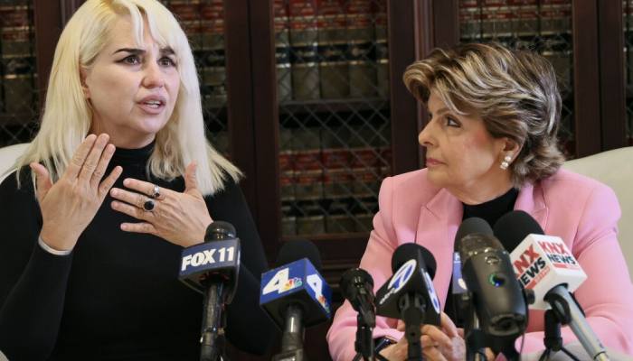 Nichol Lechmanik (L) along with her attorney Gloria Allred (R) at a press conference