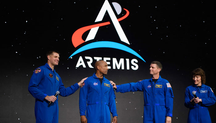 (L-R) Astronauts Jeremy Hansen, Victor Glover, Reid Wiseman and Christina Hammock Koch celebrate after being selected for the Artemis II mission. — AFP/File