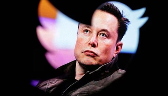 Elon Musks photo is seen through a Twitter logo in this illustration taken October 28, 2022.—Reuters