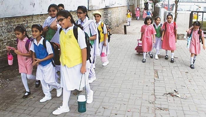 This picture shows students walking towards their school. — Online/File