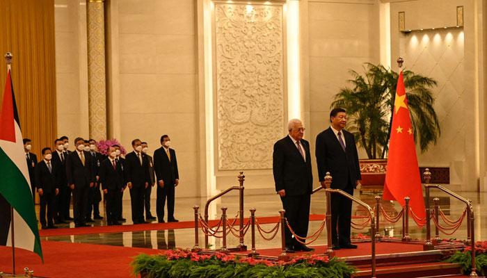 Chinas President Xi Jinping (R) and Palestinian President Mahmud Abbas attend a welcoming ceremony at the Great Hall of the People in Beijing on June 14, 2023. — AFP