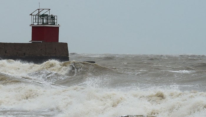 A general view shows waves crashing at Mandvi beach some 100km southeast of Jakhau Port on June 15, 2023, ahead of Cyclone Biparjoy landfall. Howling gales and crashing waves pounded the coastline of India and Pakistan on June 15, hours before the landfall of a powerful cyclone that has prompted mass evacuations. — AFP