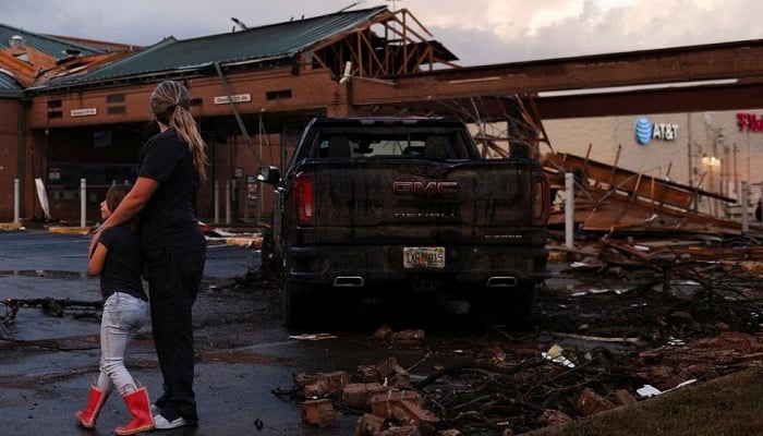 People survey the damage to a shopping centre after a tornado in a widespread storm system touched down in Round Rock, Texas, U.S., March 21, 2022. —Reuters/File