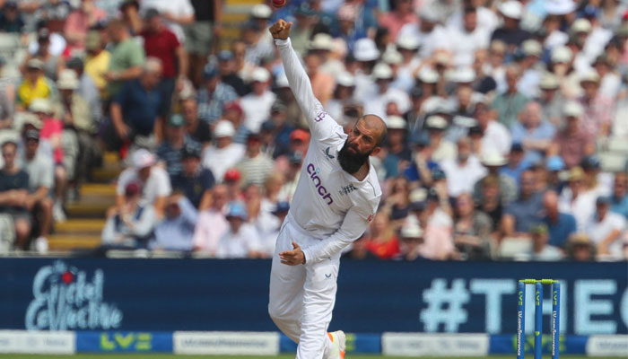 England´s Moeen Ali bowls on day three of the first Ashes cricket Test match between England and Australia at Edgbaston in Birmingham, central England on June 18, 2023. — AFP