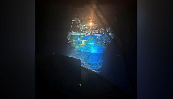 An undated handout photo provided by the Hellenic Coast Guard shows migrants onboard a boat during a rescue operation before their boat capsized at open sea off Greece. — Reuters