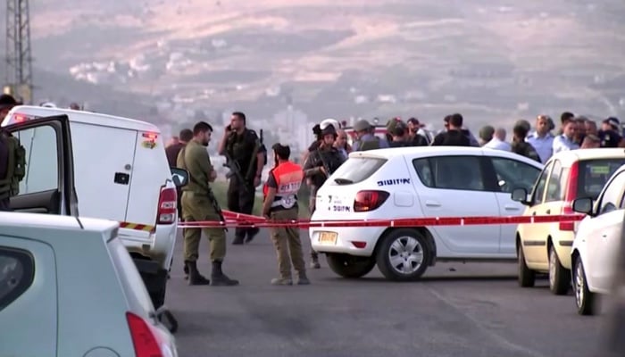 Members of Israeli forces gather at the scene of a shooting incident in the Israeli-occupied West Bank, in this still image taken from a video. — Reuters/File