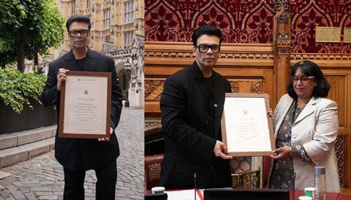 Karan Johar receives an award for his contribution in the global entertainment