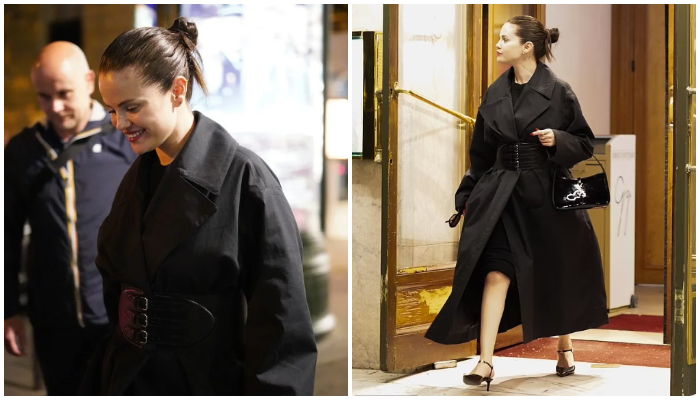 Selena Gomez cuts a stylish figure in a little black dress and trench coat