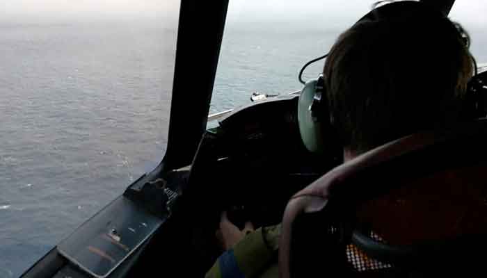The pilot of a Royal Canadian Air Force CP-140 Aurora maritime surveillance aircraft of 14 Wing flies a search pattern for the missing OceanGate submersible, which had been carrying five people to explore the wreck of the sunken SS Titanic, in the Atlantic Ocean off Newfoundland, Canada June 20, 2023 in a still image from video. —Reuters