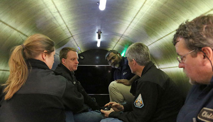 In this picture, the people can be seen sitting inside the submersible Titan, capable of carrying five people including a pilot for deep sea exploration. — OceanGate/File