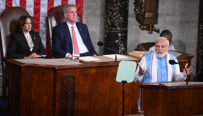 Indias Prime Minister Narendra Modi addresses a joint meeting of Congress as US Vice President Kamala Harris and House Speaker Kevin McCarthy look on at the US Capitol in Washington, DC, on June 22, 2023. — AFP